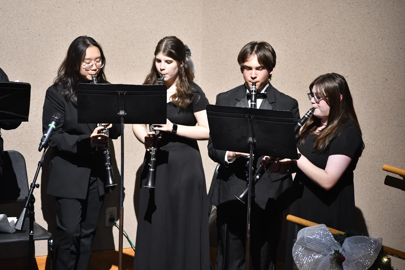Small ensemble of student musicians performs together in December 2025