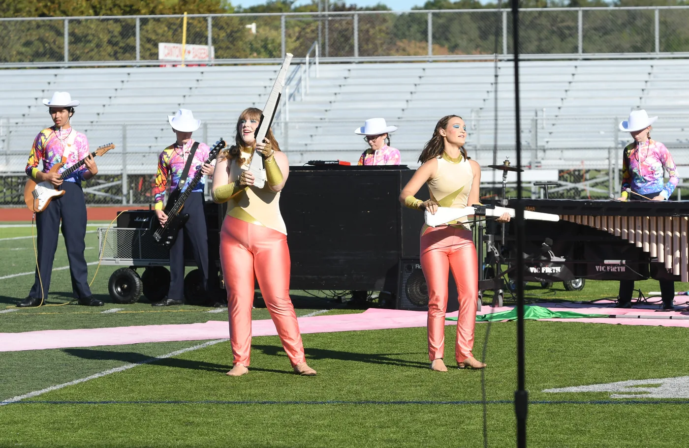 South Lyon Marching Band and Color Guard perform on the football field in 2024