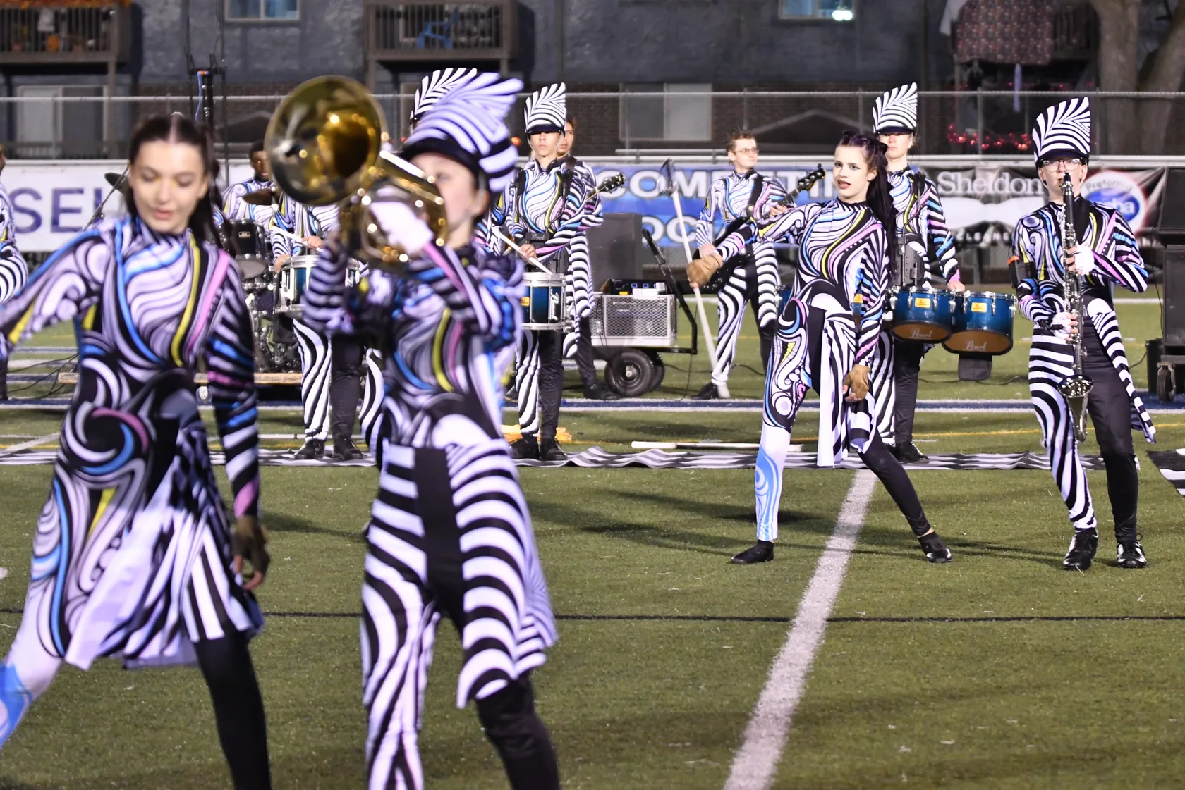 South Lyon Marching Band and Color Guard performing together at a 2025 competition